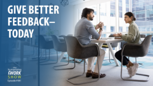 Two office workers having a discussion about feedback.